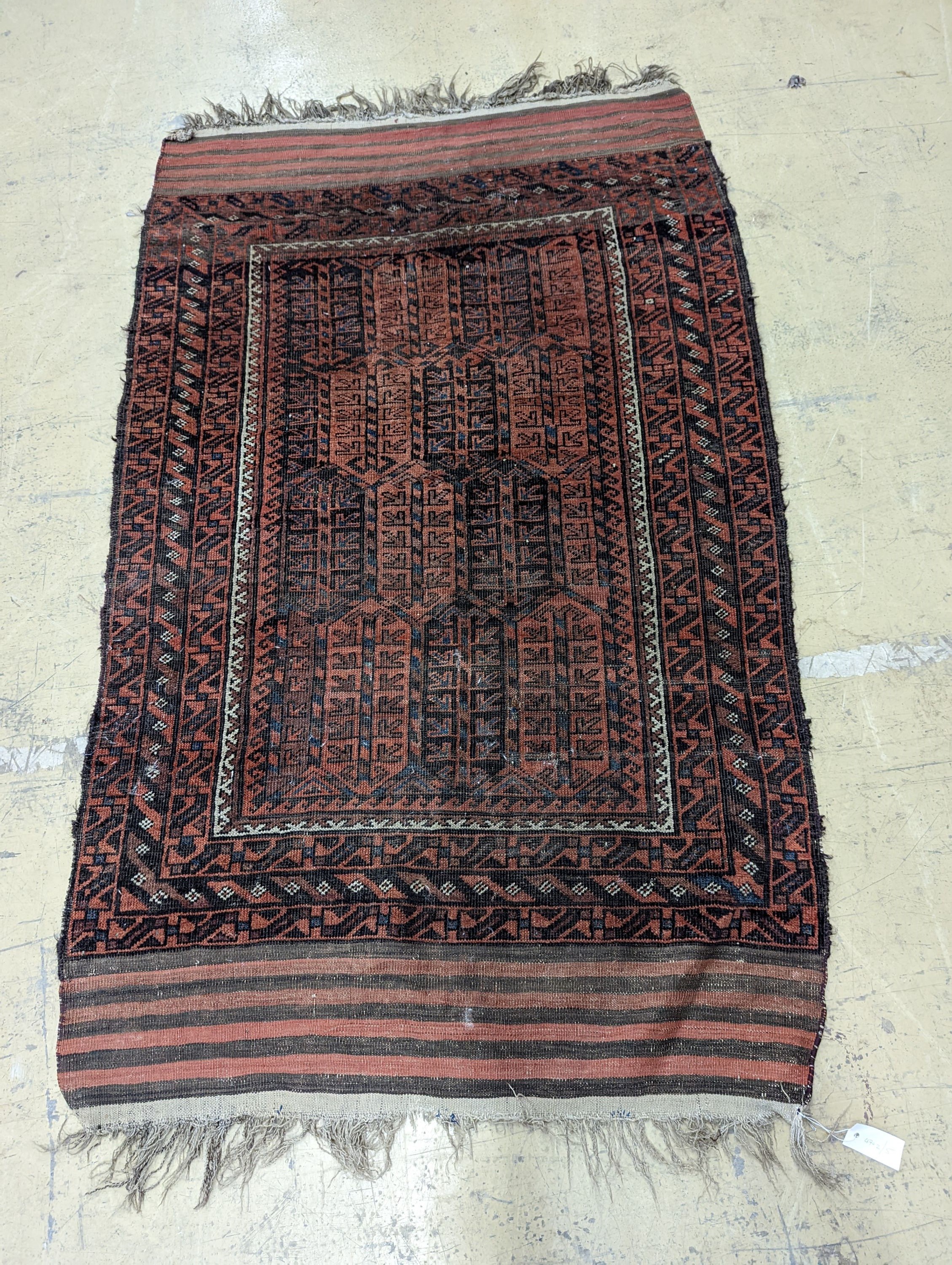 A Belouch red ground rug and a prayer rug, largest 178 x 106cm